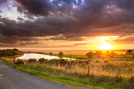 Scenic View of Agricultural Field Against Dramatic Sky thumbnail