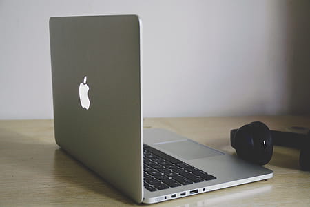 MacBook Pro near headphones thumbnail