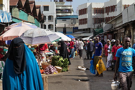people walking on street near houses at daytime thumbnail
