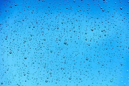 close-up photo of water drops under blue sky during daytime thumbnail