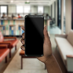 person holding Samsung Galaxy S8+ thumbnail