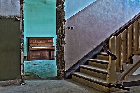 brown wooden upright piano inside the room thumbnail