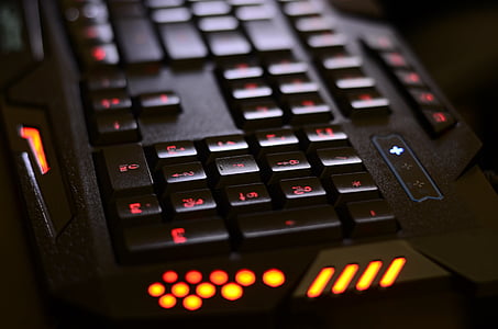 black and red gaming computer keyboard close-up photography thumbnail