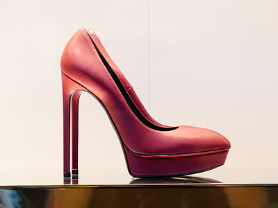 pair of red leather platform stilettos on brown surface thumbnail