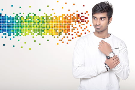man holding his wrist wearing round white and silver-colored analog watch with black strap thumbnail