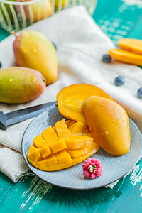 mangoes on round striped plate thumbnail