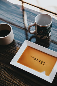 two white ceramic mug placed near rectangular white ceramic plate thumbnail