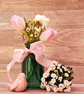 pink flowers in green glass vase thumbnail