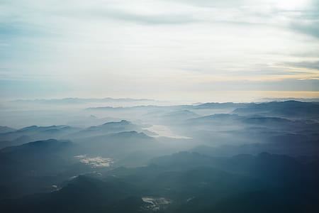 aerial photo of mountain covered with fogs during daytime thumbnail
