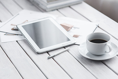 Coffee on a table with other items thumbnail