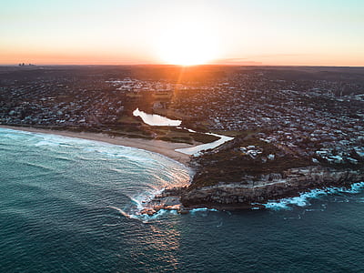 bird eye photography of city near body of water thumbnail
