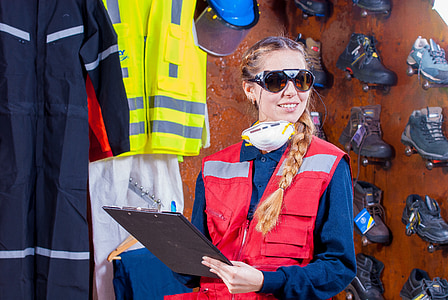 woman wearing red vest holding clip board thumbnail