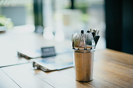 silver cutlery lot on table top thumbnail