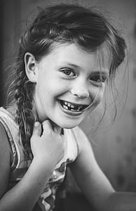 grayscale photography of smiling girl thumbnail