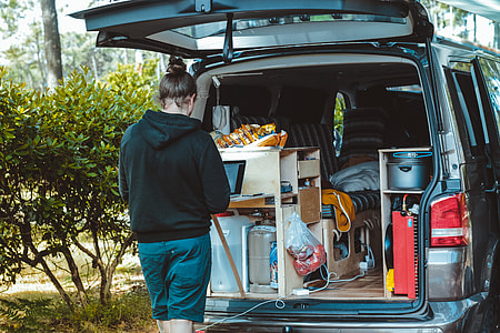woman standing at the back of the car thumbnail