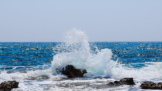 black stone beside water thumbnail