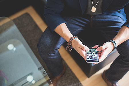 Man Browsing on his iPhone thumbnail