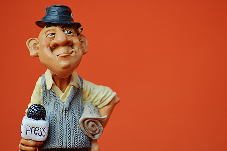 blue and beige dressed figurine thumbnail
