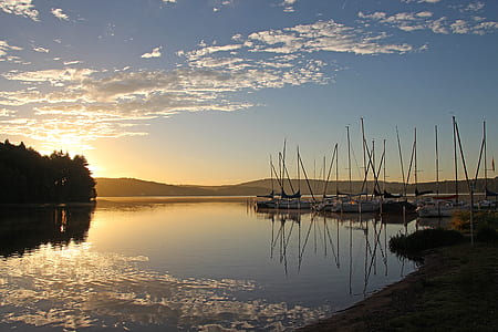 boats on dock during golden hour thumbnail