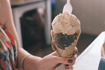 woman holding ice cream in cone thumbnail