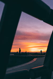 silhouette photo of people walking during golden hour thumbnail