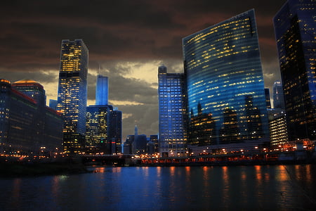 blue high rise building near body of water thumbnail