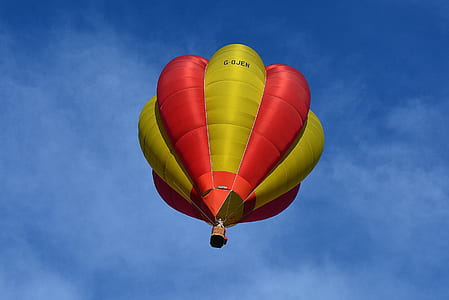 Yellow and Red Hot Air Balloon in Sky thumbnail