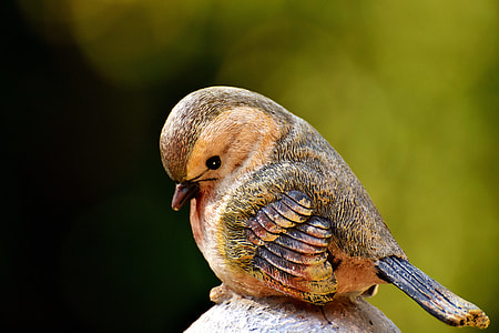 brown and green bird wooden figurine thumbnail