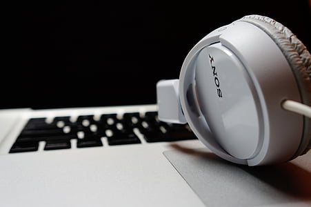 white Sony headphones on MacBook thumbnail