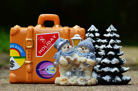 two bears near pine tree ceramic figurines beside ceramic briefcase on floor thumbnail