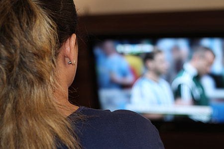 woman watching a football game thumbnail