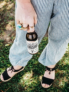 woman holding Slingshot bottle thumbnail