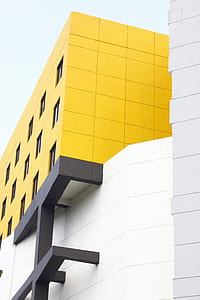 yellow and white high rise building thumbnail
