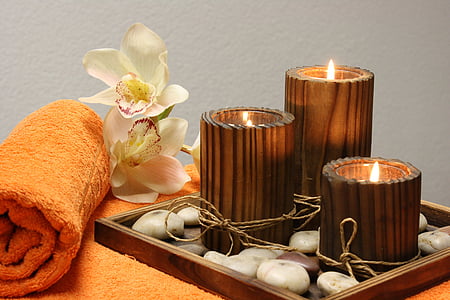 three brown wooden tealight candle holders and white orchid flowers thumbnail