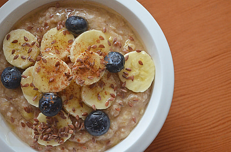 sliced bananas and blueberries on plate thumbnail
