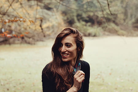 women standing on grass thumbnail