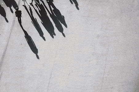 group of people walking on gray pavement thumbnail