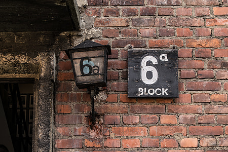 black sconce on concrete brick wall thumbnail