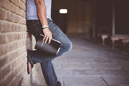 person leaning on wall thumbnail