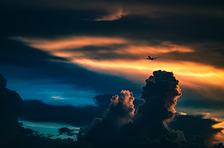 silhouette photo of plane near clouds thumbnail