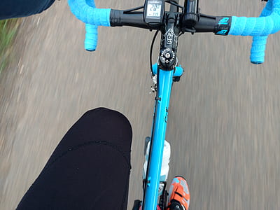 person riding blue road bicycle thumbnail