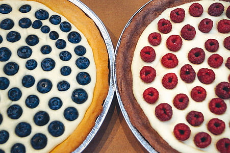 two round baked pizzas thumbnail