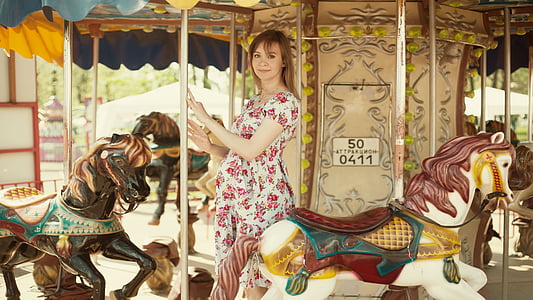 woman standing on carousel thumbnail