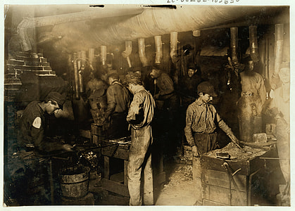 grayscale photo of group of chefs cooking in room thumbnail
