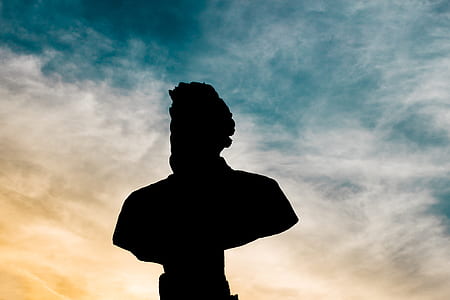 human statue under blue sky thumbnail