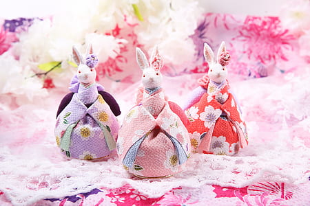 closeup photo of three white rabbit plush toys thumbnail