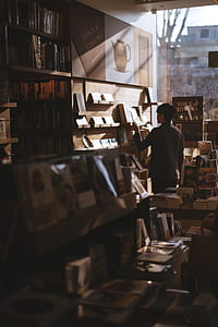 man looking at the book thumbnail