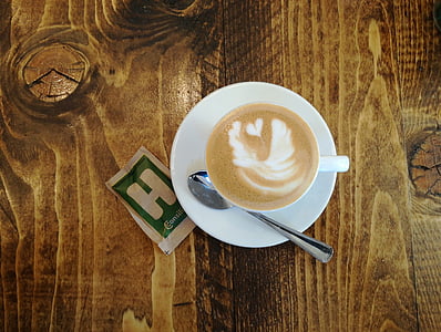 cappuccino cup placed on wood thumbnail