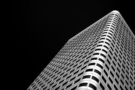 low-angle photography of white concrete building thumbnail