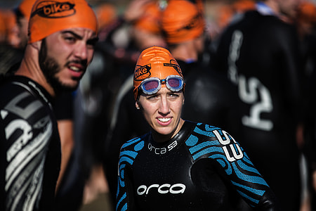 woman wearing orange swimming cap thumbnail